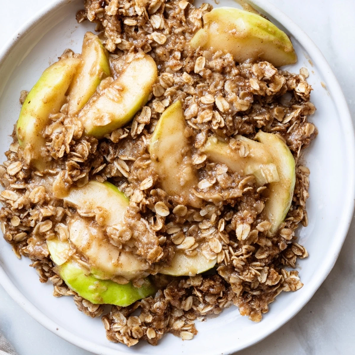 Warm Cinnamon Oat Apple Crisp bubbling hot from the oven, with a golden oat topping.