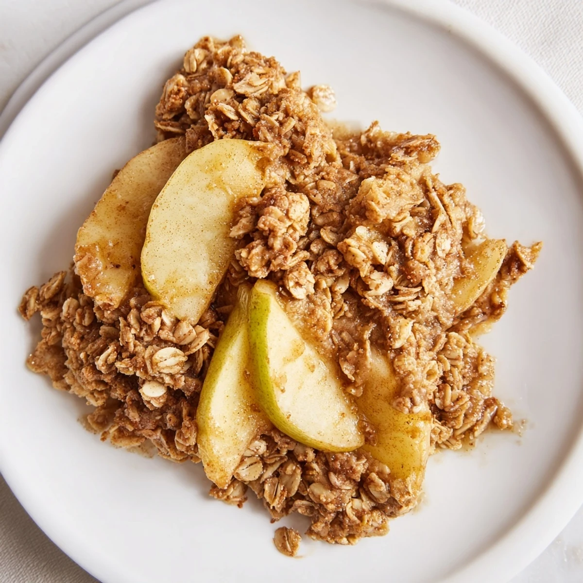 Crisp golden topping covers this warm Cinnamon Oat Apple Crisp, enticing you with its comforting aroma.