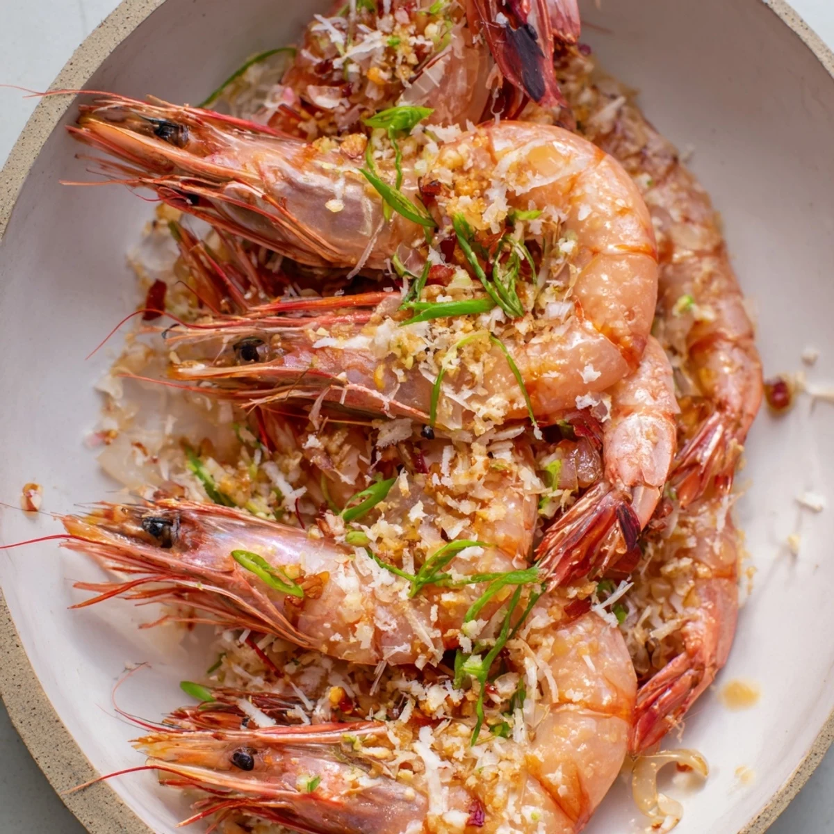 Delicious One-Skillet Lemon Garlic Shrimp Angel Hair Pasta, ready to serve with Parmesan cheese and parsley.