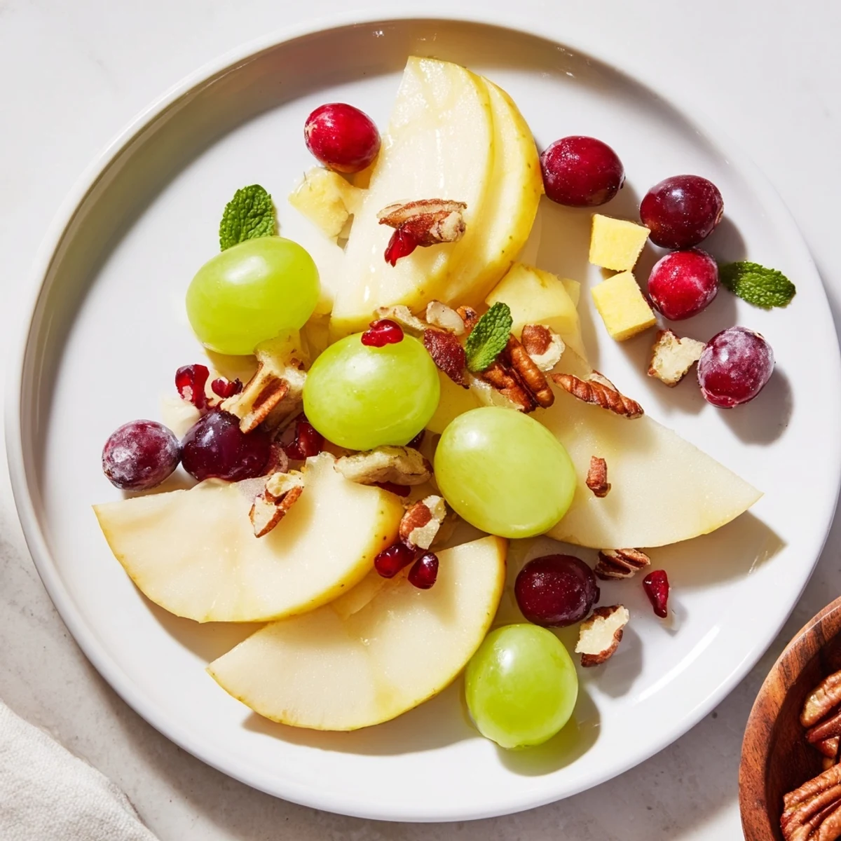 Freshly sliced apples and pears featured on an Apple Orchard Fruit Board, ready for snacking with honey.