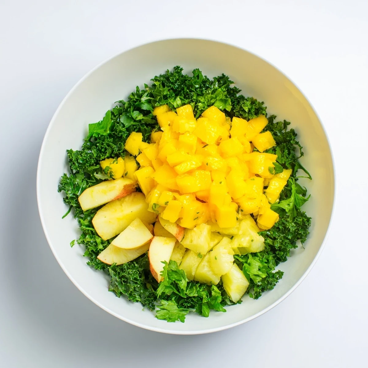 The Sunlit Glade salad features a sunny fruit centerpiece surrounded by kale and herbs, ready to serve. 