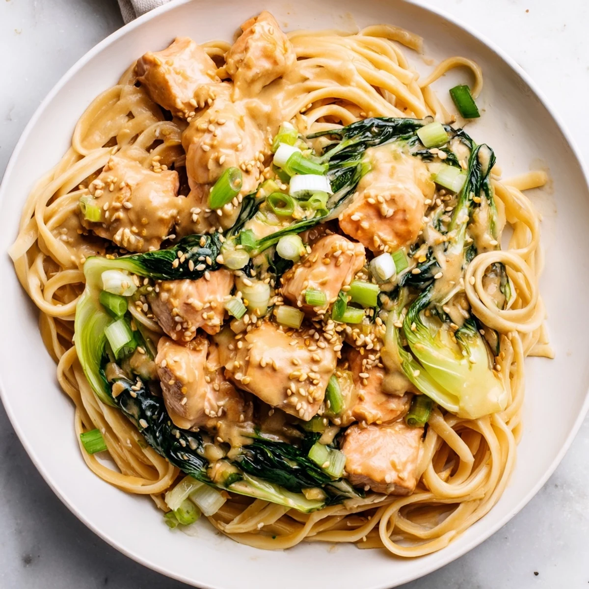 Creamy Miso Butter Salmon Pasta: a delicious bowl of tender salmon and pasta, ready to eat.