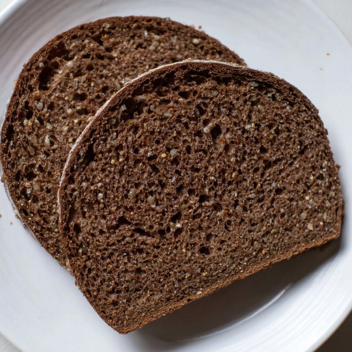 Warm, freshly baked Estonian Leib sourdough loaf, full of caraway flavor, perfect for cheese.