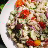 Overhead view of refreshing Mediterranean White Bean Salad with Feta, bright and colorful.