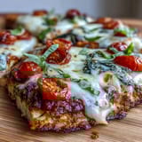 High-protein cottage cheese flatbread pizza topped with fresh tomatoes and basil.