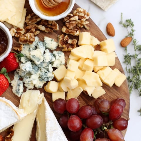 Overflowing The Waterfall Edge Grazing Board, a visually stunning appetizer ready for your party.