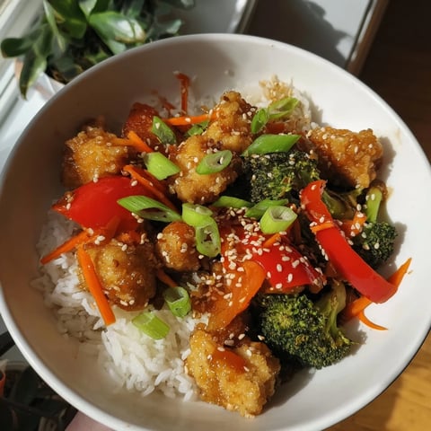 Golden-brown crispy tofu glistening in the honey garlic glaze, part of the delicious Honey Garlic Tofu Bowls.