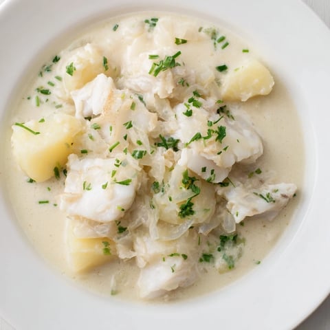 Creamy Icelandic Fish Stew, filled with flaked white fish, potatoes, and fresh herbs, is ready to eat.