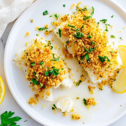 Flaky, baked cod fillets topped with a buttery Ritz cracker crust, fragrant and delicious.
