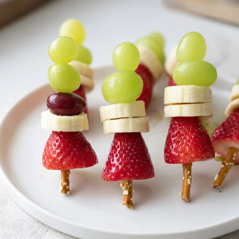Up-close photo of Elf Hat Strawberry Skewers, a quick and fun fruit snack for kids.