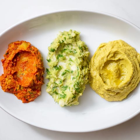 A view of the colorful Dip Trio, served with fresh vegetables and inviting dippers for guests.