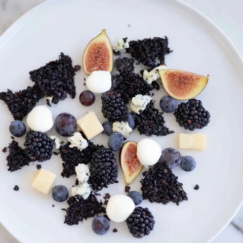 This Deep Indigo Midnight Sky cheese board recipe offers a beautiful arrangement of dark fruits and cheeses.