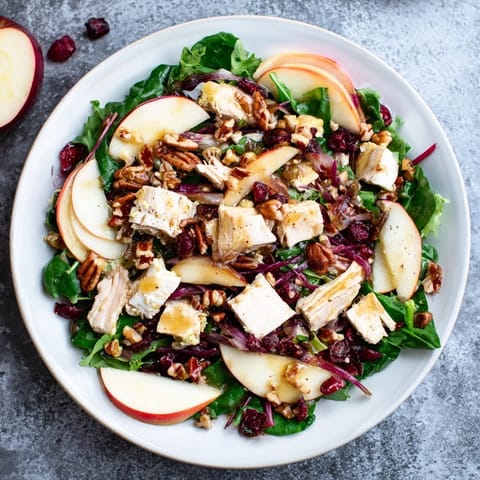 This Chicken and Apple Winter Salad features juicy apples and tender chicken, drizzled in tangy dressing.