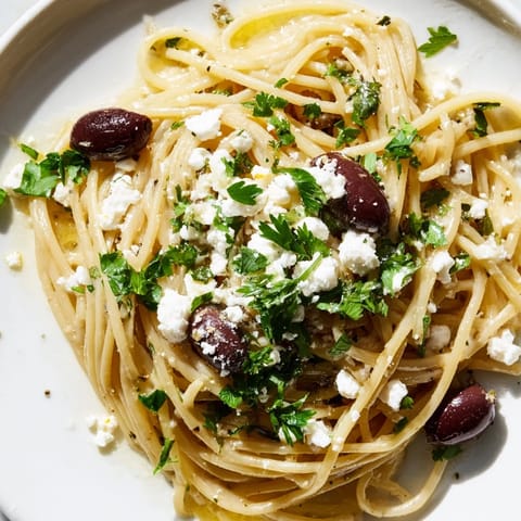 Bright Mediterranean flavors shine in this Greek Chicken Spaghetti, with tender chicken, briny olives, and creamy feta over al dente pasta.  