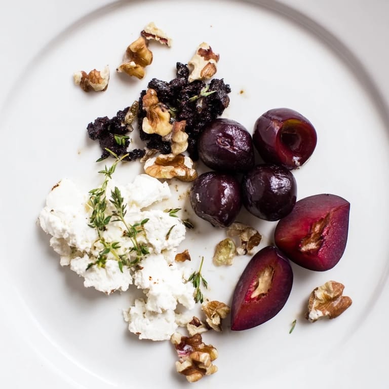 Vibrant image: the Midnight Orchard features fresh fruit, black-ashed cheese, and honey drizzle.