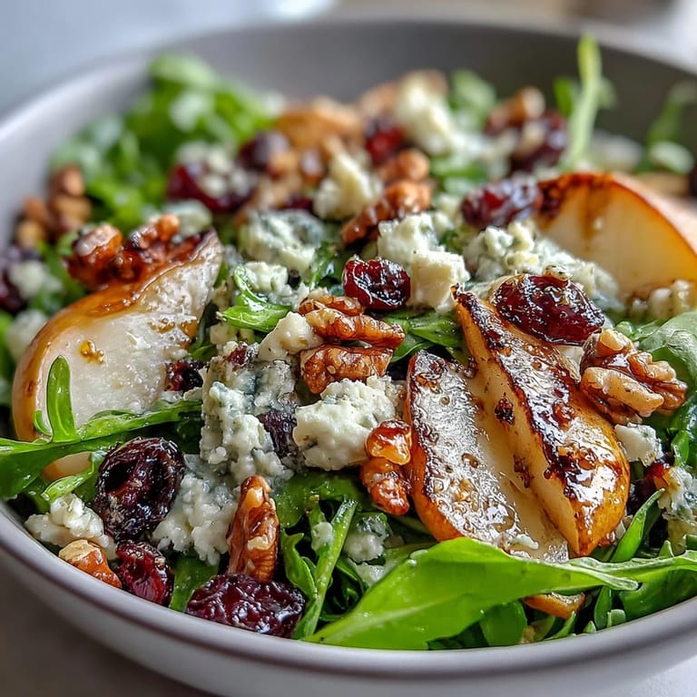Vibrant Pear Gorgonzola Salad, a delightful mix of fruit, cheese, and greens.