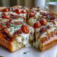 Kentucky Derby Hot Brown Flatbread Pizza with roasted turkey, bacon, and creamy Mornay sauce on a crispy crust, perfect for Derby Day entertaining.
